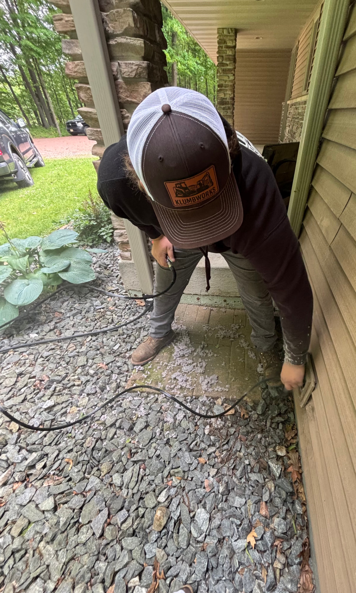 Jon of KlumbWorks cleaning a dryer vent line at a Central Wisconsin home.